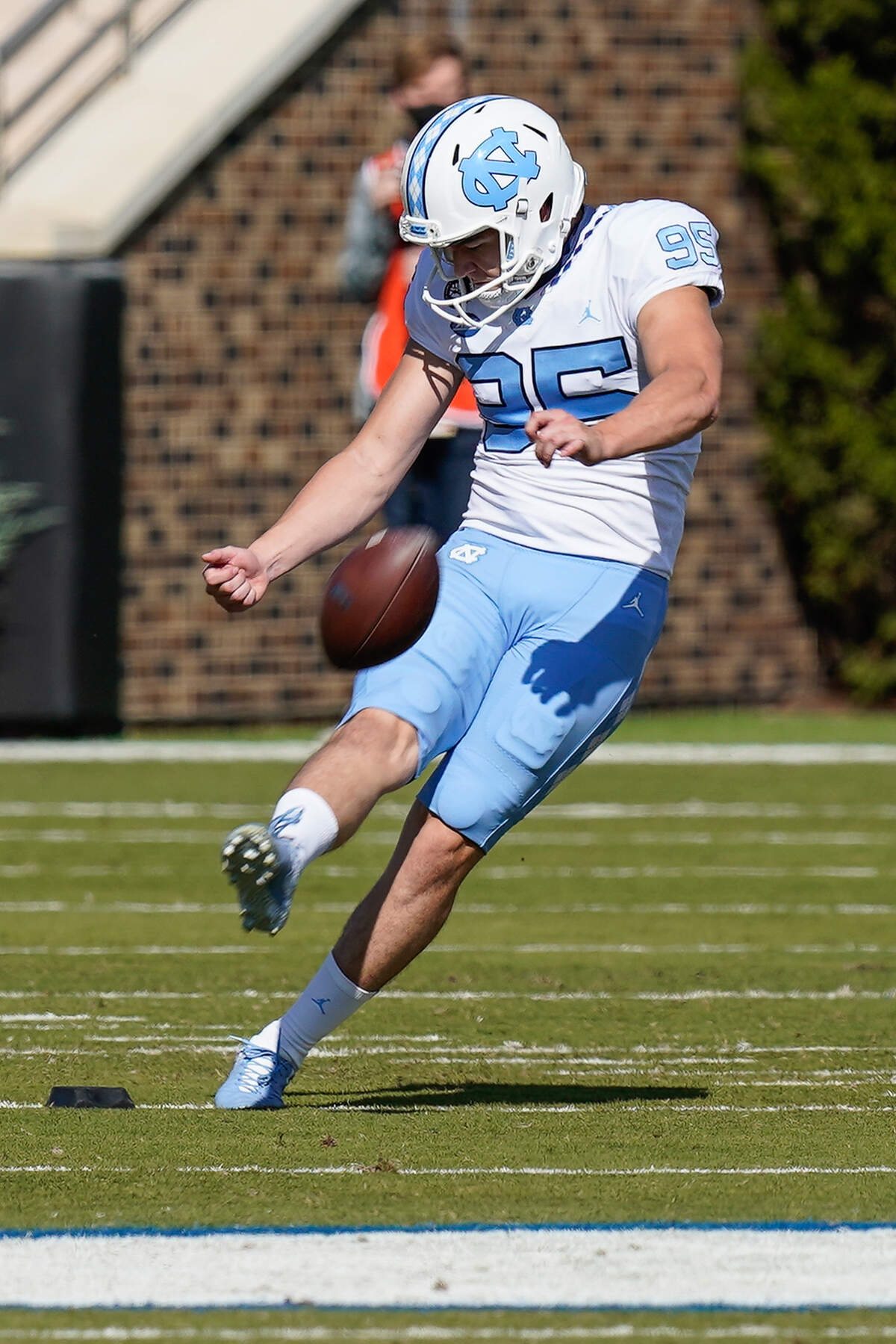 North Carolina Tar Heels place kicker Jonathan Kim (95) kicks off against the Duke Blue Devils during the first quarter at Wallace Wade Stadium.