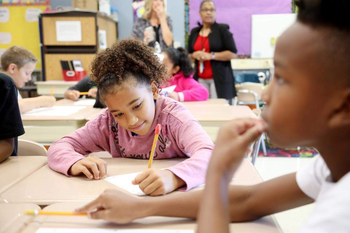 Third graders Ana Toller, left, and D’Ki Watson, right, work on math problems collaboratively at Fox Road Elementary School in North Raleigh on Wednesday, Sept. 11, 2019. The school doubled its passing rate on state exams over the last seven years and its students are exceeding growth expectations on tests.