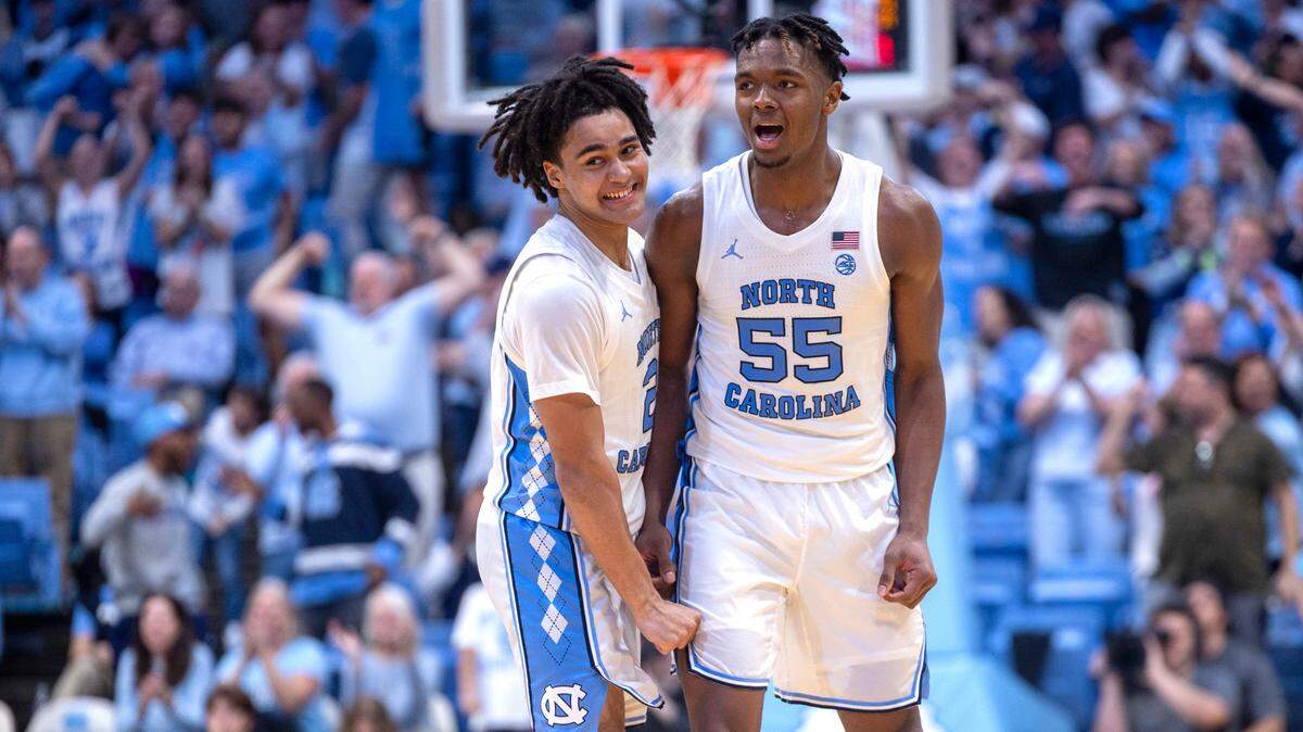 North Carolina’s Elliot Cadeau (2) and Harrison Ingram (55) react after a Cadeau basket to give the Tar Heels’ a 58-56 lead, after overcoming a fourteen point Florida State lead, in the second half on Saturday, December 2, 2023 at the Smith Center in Chapel Hill, N.C.