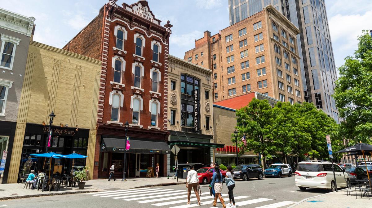 Pedestrians cross Fayetteville St. in downtown Raleigh in this 2019 file photo.