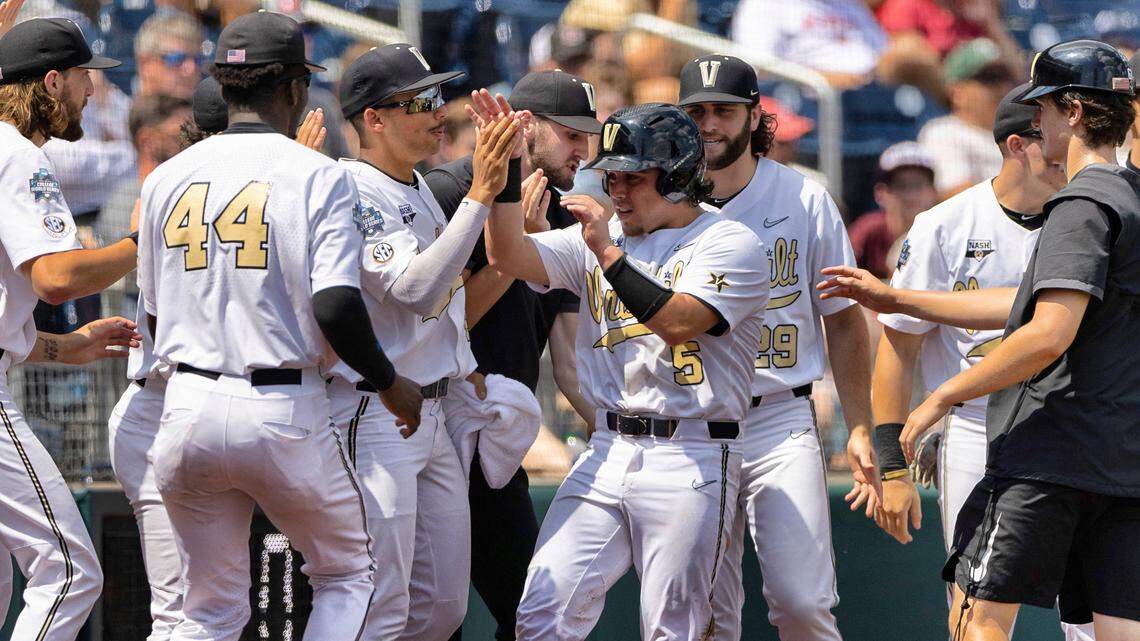 Vanderbilt’s CJ Rodriguez (5) celebrates with teammates after scoring off a wild pitch from North Carolina State in the fourth inning during a baseball game in the College World Series, Friday, June 25, 2021, at TD Ameritrade Park in Omaha.