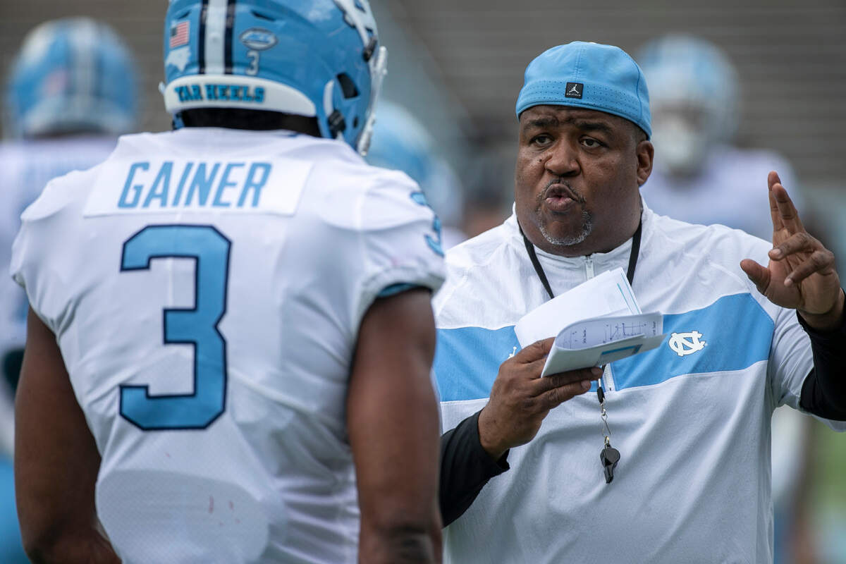 North Carolina defensive line coach Tim Cross works with Amari Gainer (3) prior to the Tar Heels’ spring football game on Saturday, April 15, 2023 at Kenan Stadium in Chapel Hill, N.C.