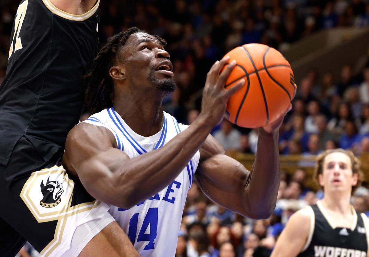 Duke’s Sion James (14) drives to the basket while being fouled by Wofford’s Jeremy Lorenz (32) during the first half of Duke’s game against Wofford at Cameron Indoor Stadium in Durham, N.C., Saturday, Nov. 16, 2024.