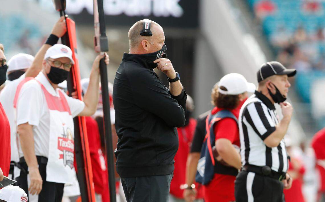 N.C. State head coach Dave Doeren watches during the first half of N.C. State’s game against Kentucky in the Gator Bowl at TIAA Bank Field in Jacksonville, Fla., Saturday, January 2, 2021.