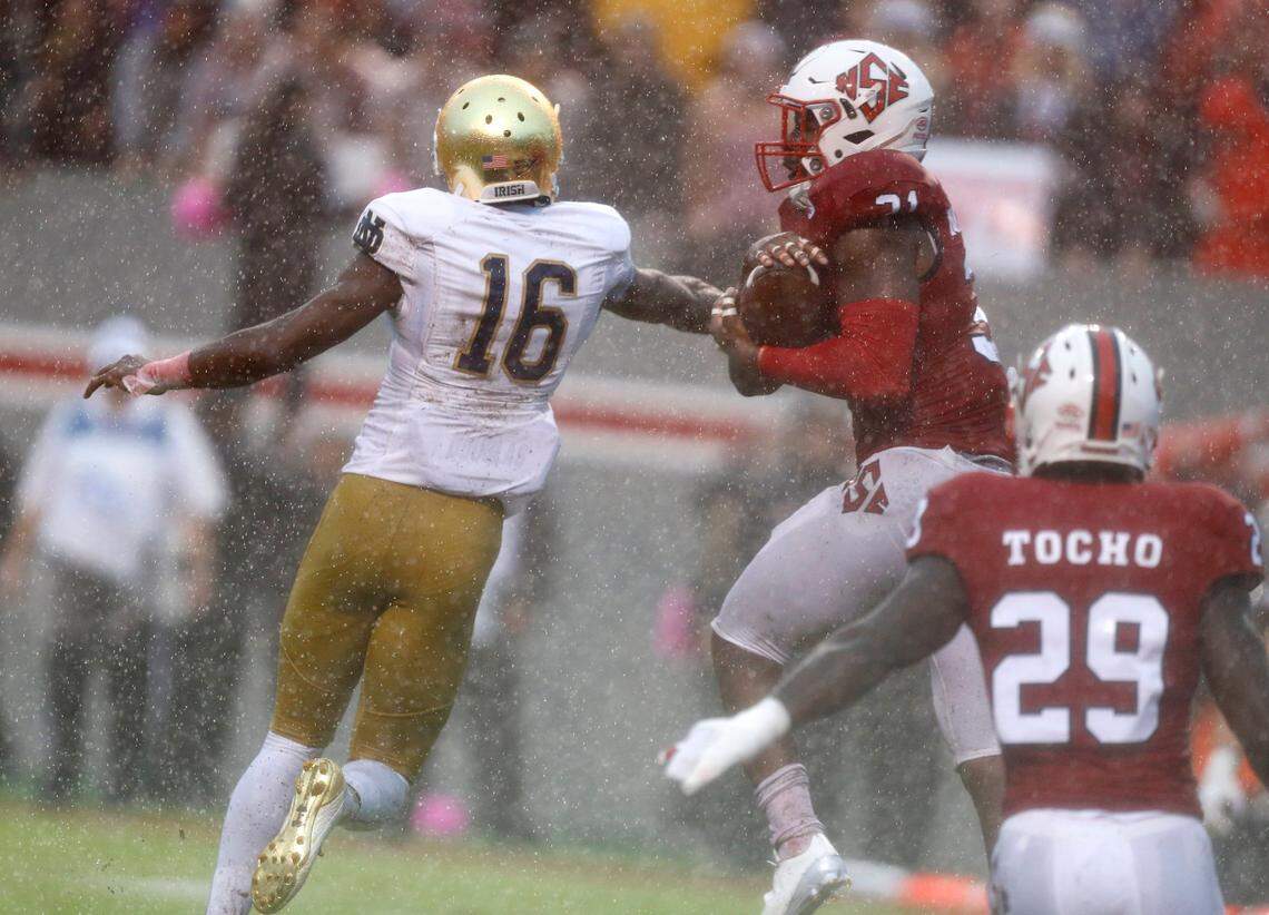 N.C. State safety Jarius Morehead (31) intercepts a pass intended for Notre Dame wide receiver Torii Hunter Jr. (16) during the first half of the Wolfpack’s game against Notre Dame at Carter-Finley Stadium in Raleigh, N.C., Saturday, Oct. 8, 2016.
