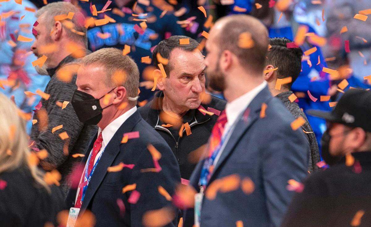 Duke coach Mike Krzyzewski leaves the court amid a shower of confetti following the Blue Devils 82-67 loss to Virginia Tech in the ACC Tournament Championship on Saturday, March 12, 2022 at Barclays Center in Brooklyn, N.Y.