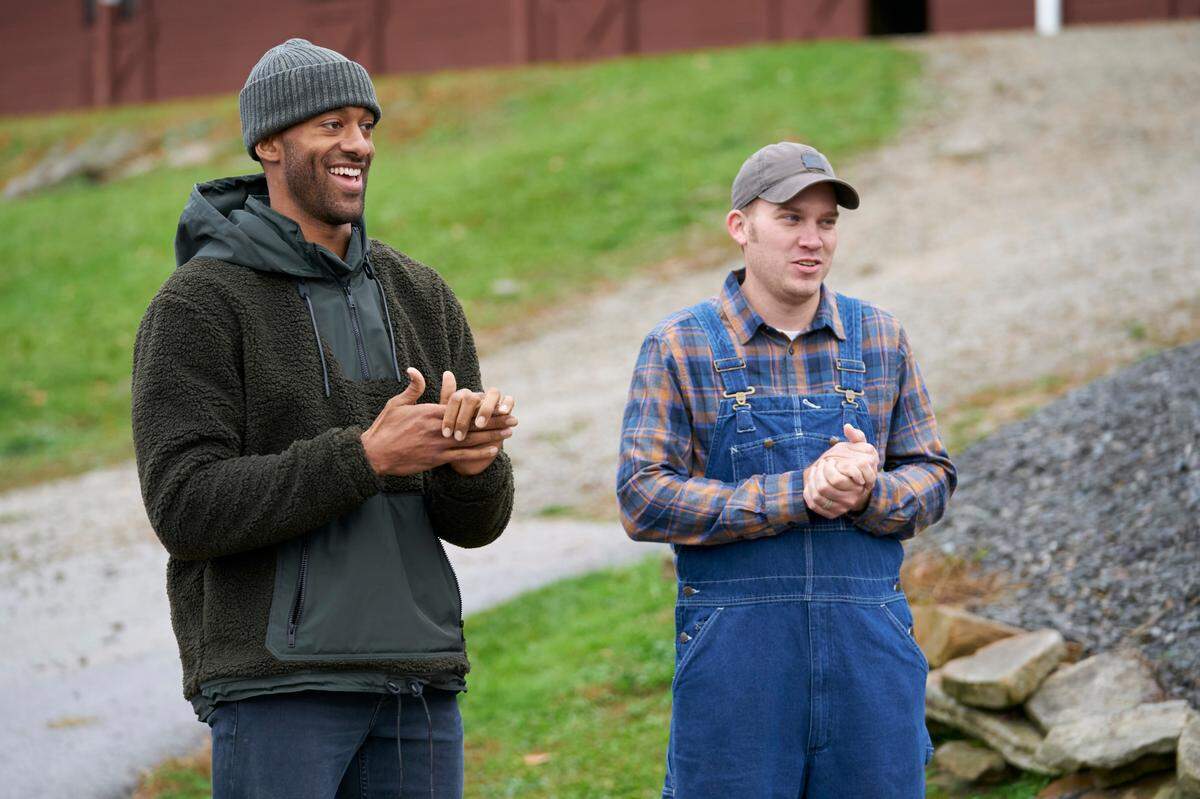 Matt James, left, a Raleigh native, with an unidentified farmer, in the Feb. 1, 2021, episode of “The Bachelor” on ABC.