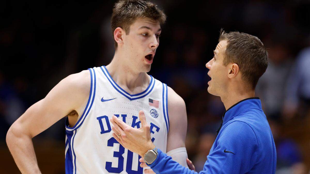 Duke head coach Jon Scheyer talks with Kyle Filipowski (30) during the second half of Duke’s 81-72 victory over Ohio State at Cameron Indoor Stadium in Durham, N.C., Wednesday, Nov. 30, 2022.