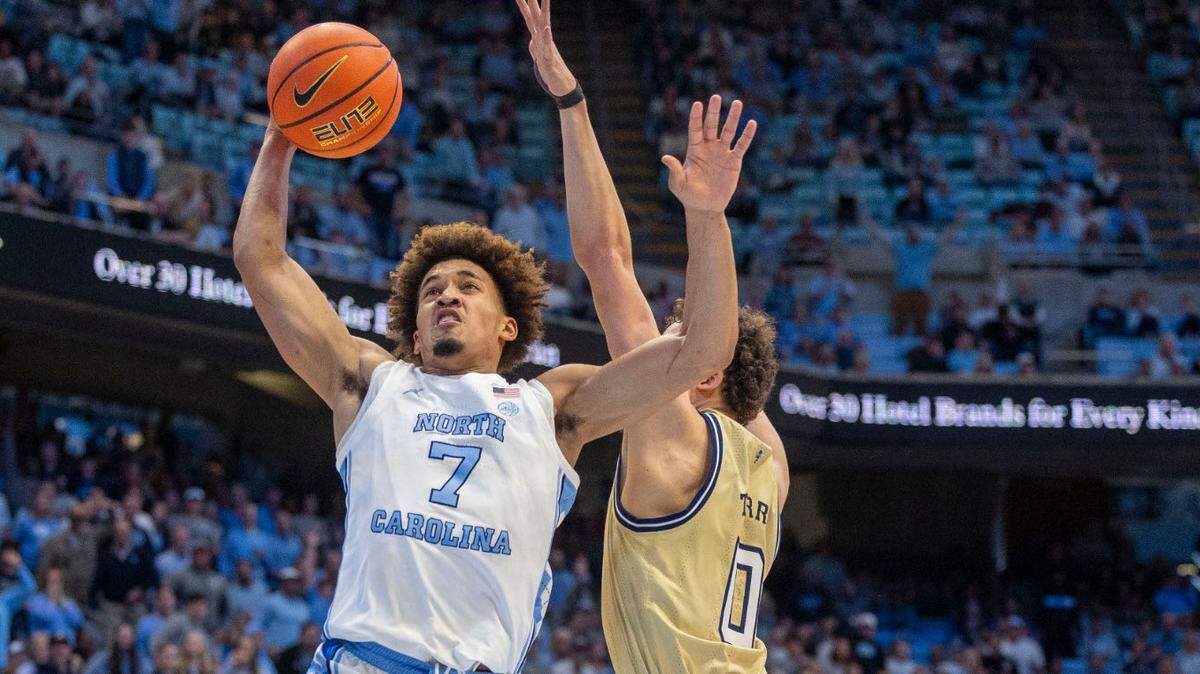 North Carolina guard Seth Trimble (7) drives to the basket against Georgia Tech’s Lance Terry (0) in the first half on Saturday, December 7, 2024 at the Smith Center in Chapel Hill, N.C