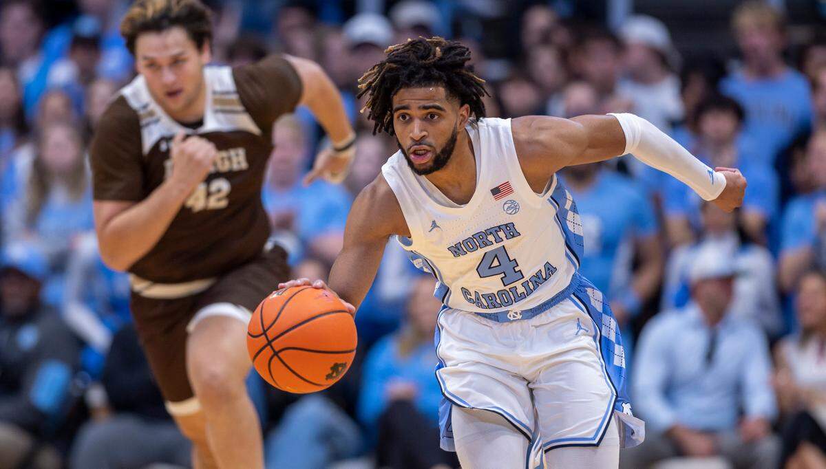 North Carolina’s R.J. Davis (4) pushes the ball up courts on a fast break ahead of Lehigh’s J.T. Tan (42) in the first half on Sunday, November 12, 2023 at the Smith Center in Chapel Hill, N.C.