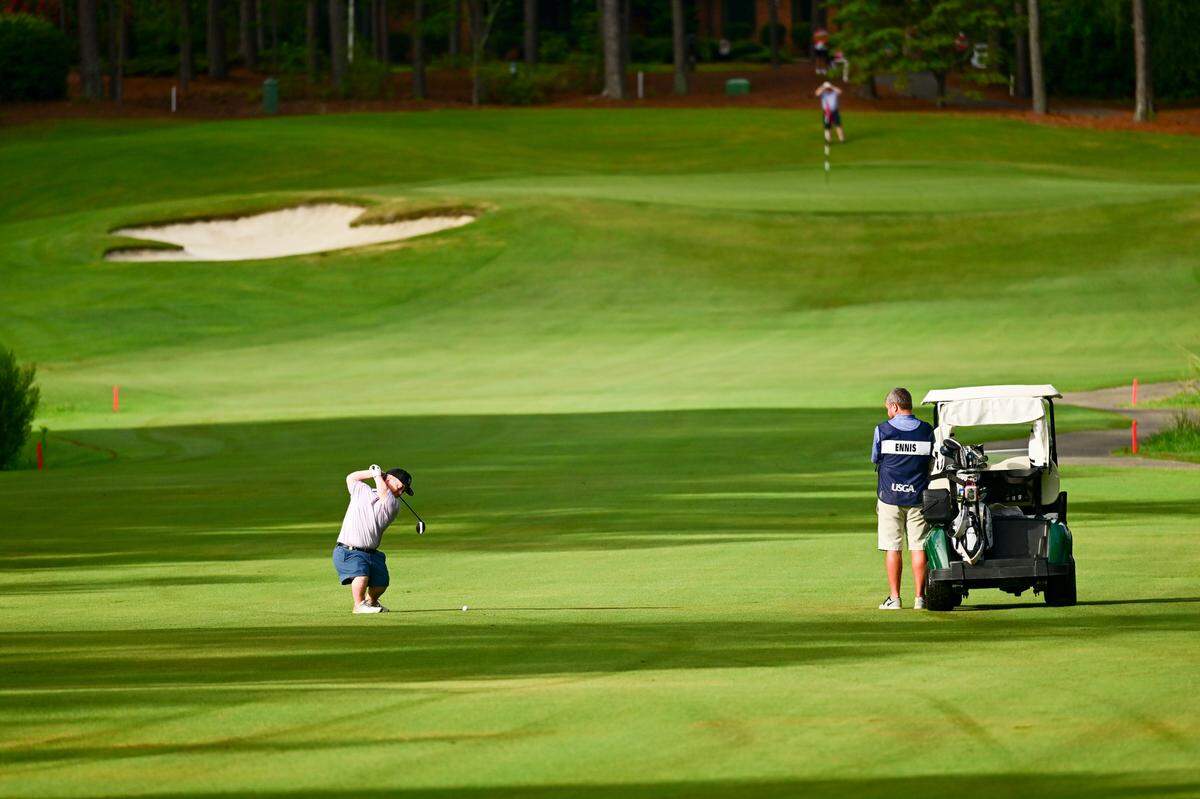Conor Ennis, Short Stature, hits his second shot on hole one during the first round at the 2022 U.S. Adaptive Open at Pinehurst Resort & C.C. (Course No. 6) in the Village of Pinehurst, N.C. on Monday, July 18, 2022. (Robert Beck/USGA)