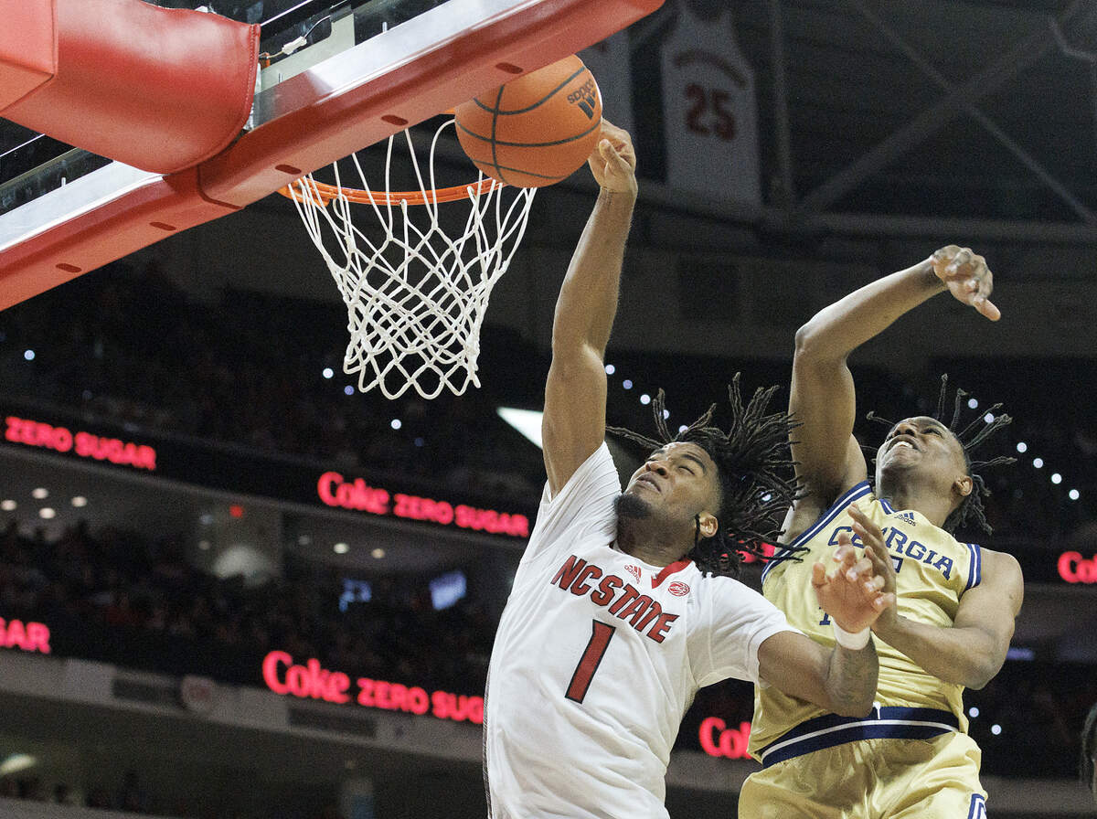 N.C. State’s Jayden Taylor is fouled as he drives to the basket past Georgia Tech’s Tafara Gapare during the second half of the Wolfpack’s 82-76 win on Saturday, Feb. 3, 2024, at PNC Arena in Raleigh, N.C.