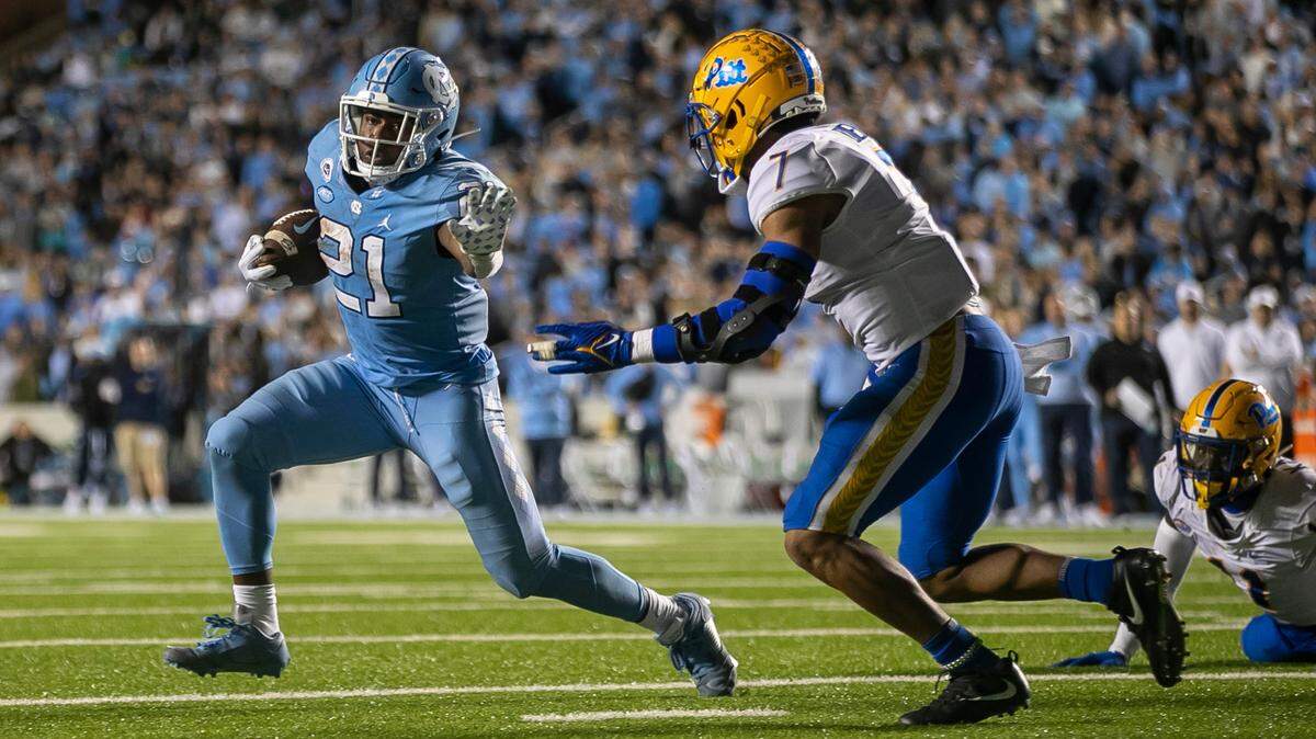 North Carolina’s Elijah Green (21) scores the game winning touchdown on a two yard run to give the Tar Heels’ 28-24 lead in the fourth quarter against Pitt on Saturday, October 29, 2022 at Kenan Stadium in Chapel Hill, N.C.