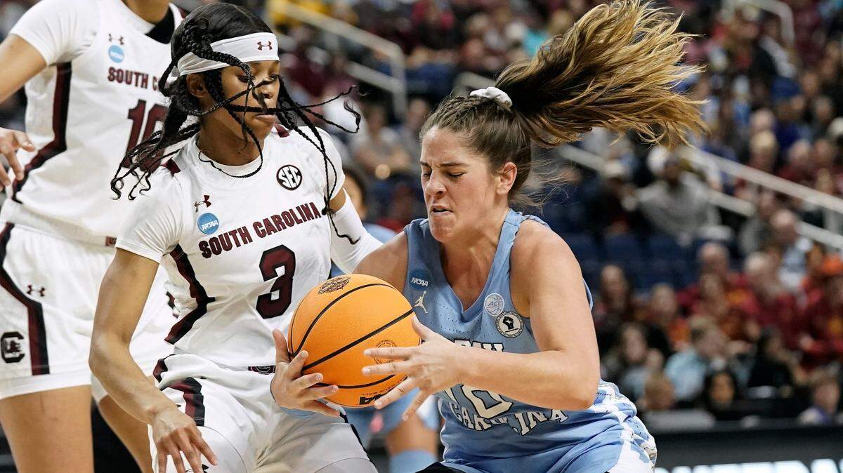South Carolina guard Destanni Henderson (3) defends against North Carolina guard Eva Hodgson, right, during the first half of a college basketball game in the Sweet 16 round of the NCAA tournament in in Greensboro, N.C., Friday, March 25, 2022.
