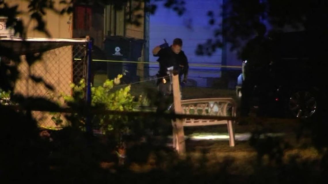 An officer investigates the scene of a killing on Barbee Street in Zebulon early Friday morning, May 13, 2022.