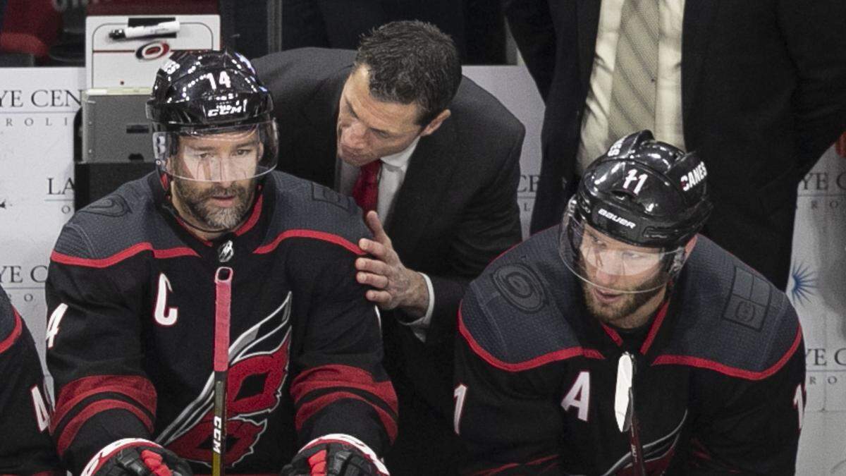Carolina Hurricanes coach Rod Brind’Amour talks with Justin Williams (14) after Williams scored on New York Islanders goalie Robin Lehner (40) during the second period in Game 4 of their Stanley Cup series on Friday, May 3, 2019 at PNC Arena in Raleigh, N.C. It was Williams’ 100th career goal.