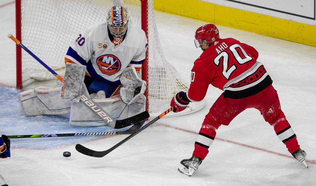 The Carolina Hurricanes Sebastian Aho (20) shoots against New York Islanders goalie Ilya Sorokin (30) in the second period during Game 2 of their Stanley Cup series on Wednesday, April 19, 2023 at PNC Arena in Raleigh, N.C.
