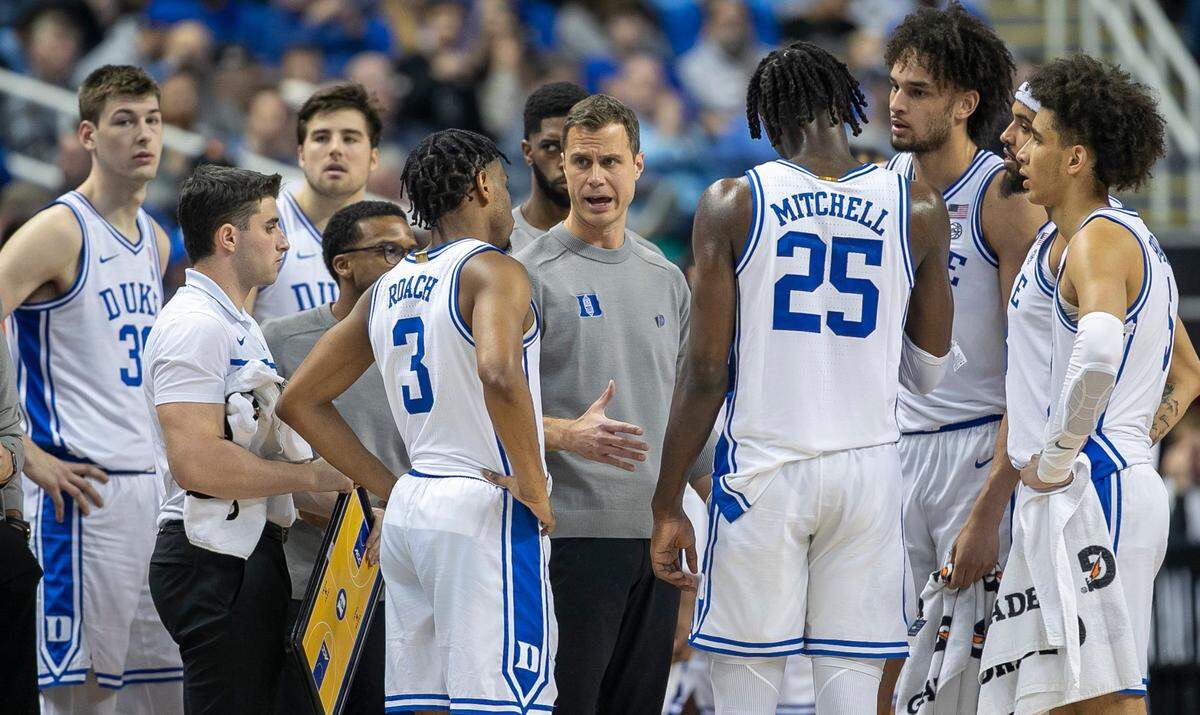 Duke coach Jon Scheyer talks with his players during a time out in the first half against Pitt during the third round of the ACC Tournament on Thursday, March 9, 2023 at the Greensboro Coliseum in Greensboro, N.C.