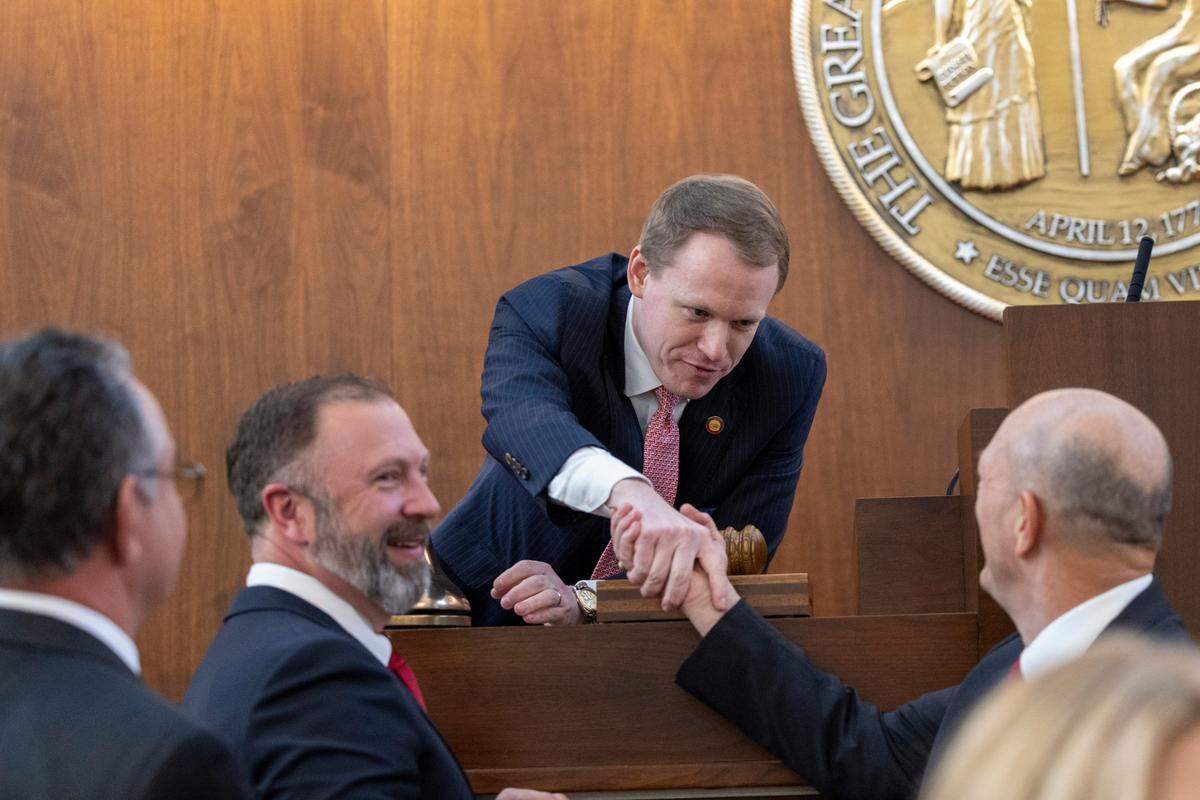 Lawmakers congratulate newly elected House Speaker Destin Hall after the North Carolina General Assembly convened for its 2025 legislative session on Wednesday, Jan. 8, 2025, at the Legislative Building.