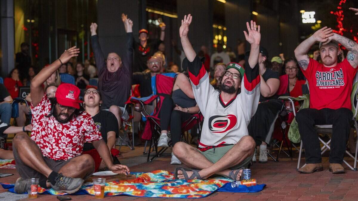 Carolina Hurricanes fans react during a Stanley Cup Final watch party in Raleigh's Smoky Hollow district on Tuesday, June 9, 2026, as the Hurricanes play the Vegas Golden Knights in Game 4 of the Stanley Cup Final.