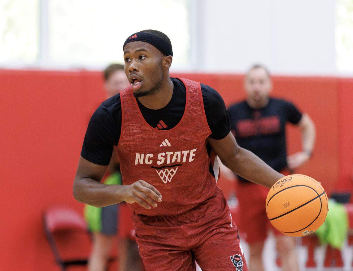 N.C. State’s Tre Holloman looks to pass during the team’s first official practice on Monday, Sept. 22, 2025, in Raleigh, N.C. at Dail Basketball Center. 