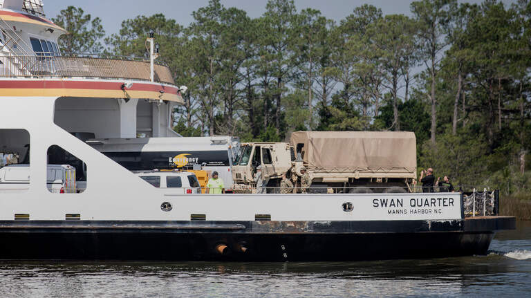 On Dorian-stricken Ocracoke, generators, water and helping hands arrive by boat