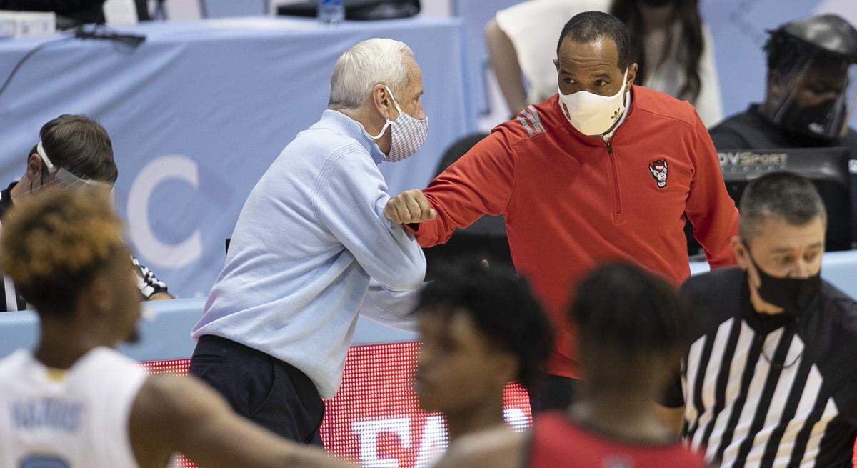North Carolina coach Roy Williams greets N.C. State coach Kevin Keatts following the Tar Heels’ 86-76 victory on Saturday, January 23, 2021 at the Smith Center in Chapel Hill, NC.