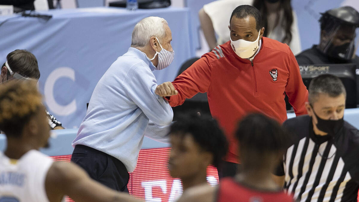 North Carolina coach Roy Williams greets N.C. State coach Kevin Keatts following the Tar Heels’ 86-76 victory on Saturday, January 23, 2021 at the Smith Center in Chapel Hill, NC.