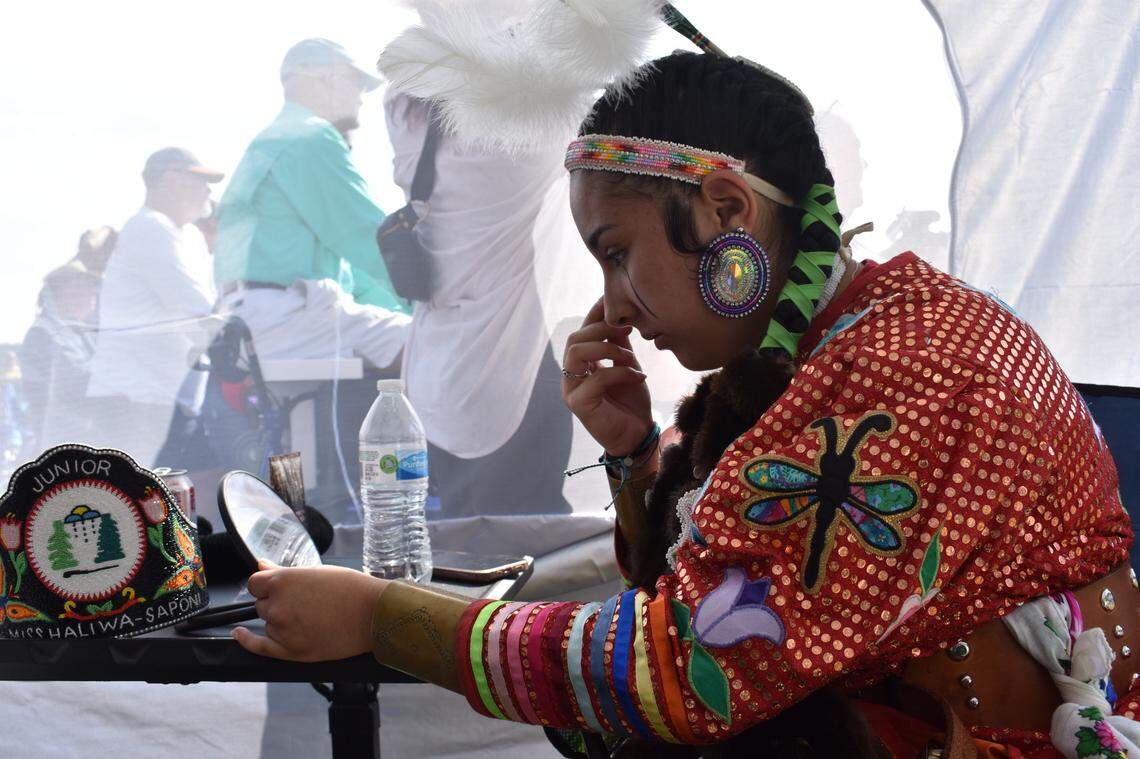 Brandy Freeman, 15, does her makeup in the mirror before competing at the Intertribal Pow Wow. She is a member of the Haliwa-Saponi tribe.