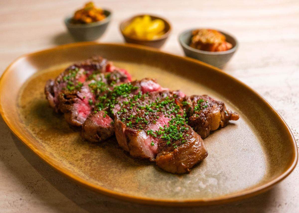 The new Raleigh restaurant Peregrine opens in April as a modern American spot with South Asian flavors, such as this dry-aged ribeye with gochujang butter.