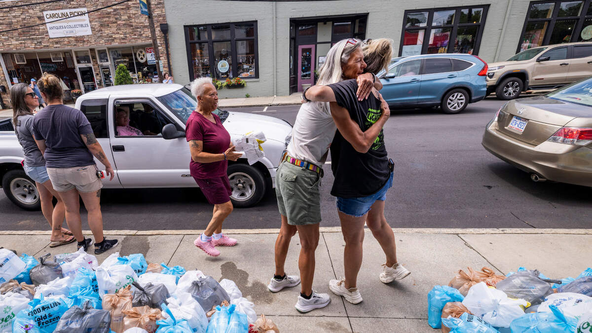 Volunteers distribute bottled water at a community-organized distribution site on Thursday, July 10, 2025, in downtown Mebane, after the Graham-Mebane Water Treatment Plant was damaged by flooding from Tropical Storm Chantal. Mebane residents were told Wednesday to ration water, with the city down to less than two days’ supply of clean drinking water.