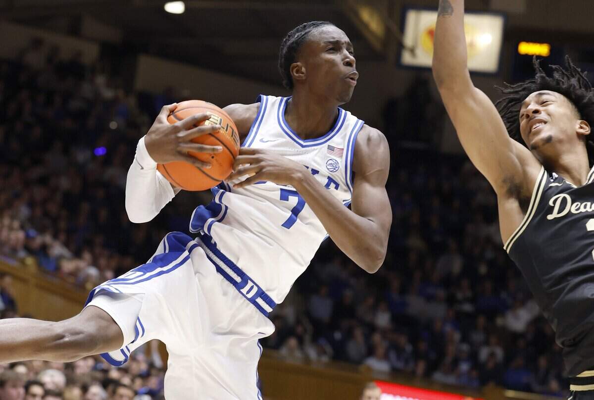 Duke’s Dame Sarr (7) pulls in the loose ball from Wake Forest's Juke Harris (2) during the first half of Duke’s game against Wake Forest at Cameron Indoor Stadium in Durham, N.C., Saturday, Jan. 24, 2026.