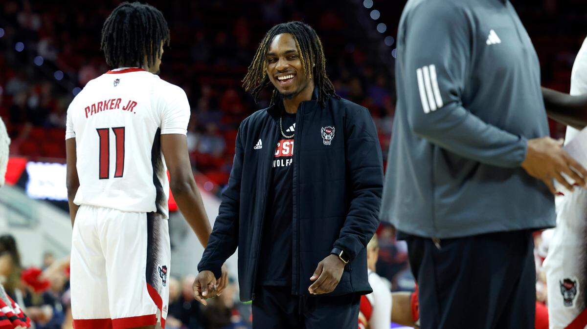 N.C. State’s Kam Woods heads back to the bench after the team huddled during a timeout in the Wolfpack’s 81-67 victory over UT Martin at PNC Arena in Raleigh, N.C., Tuesday, Dec. 12, 2023.
