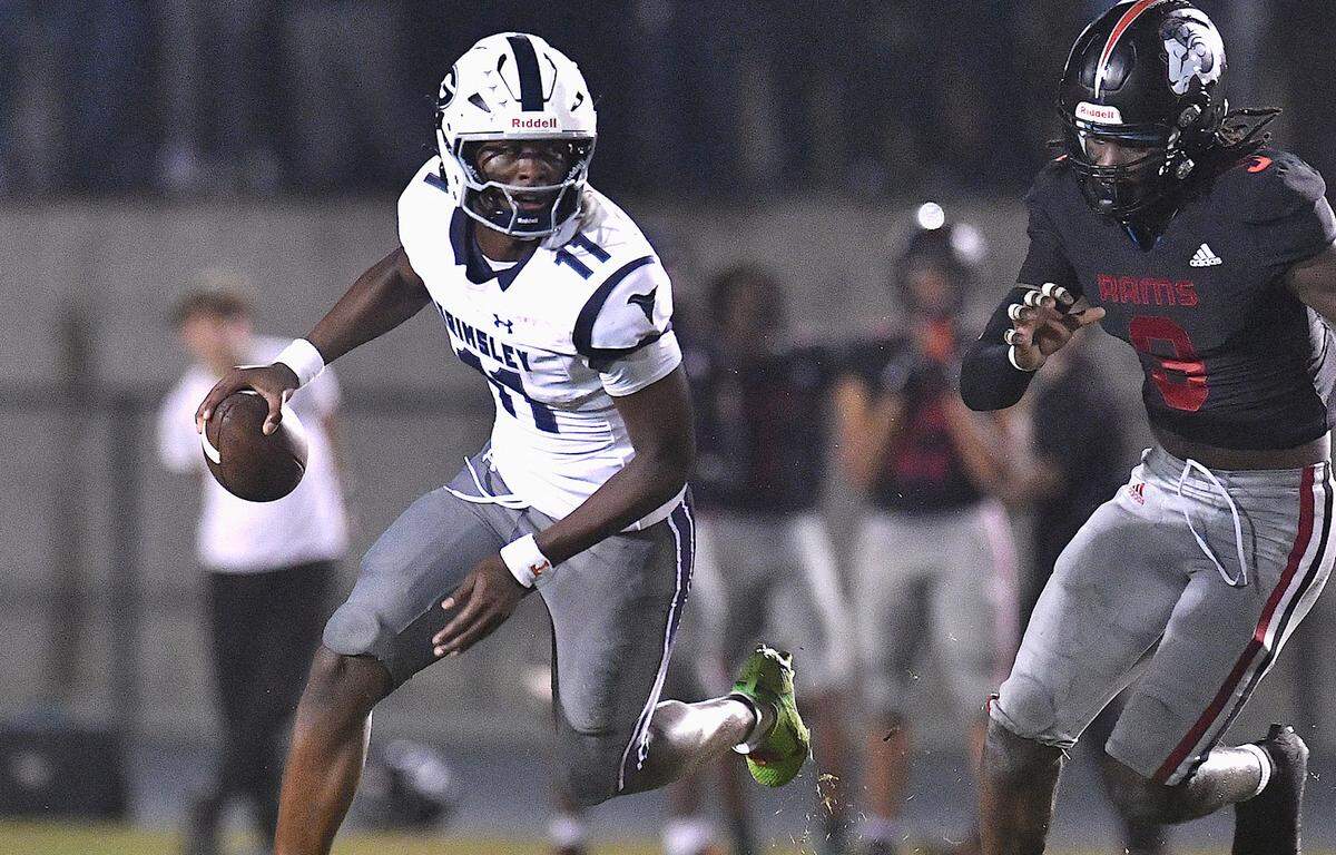 Grimsley quarterback Faizon Brandon (11) looks to pass while pursued by Rolesville’s Zavion Griffin-Haynes (9) during the first half. The Rolesville Rams and the Greensboro Grimsley Whirlies met in a non-conference football game in Rolesville, N.C. on August 30, 2024.