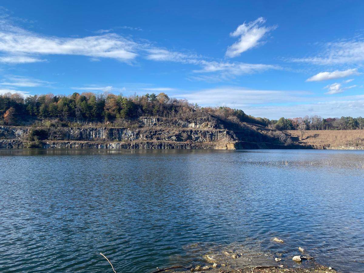 Albemarle Corp. plans to seek permits to reopen the dormant lithium mine in Kings Mountain, shown filled with 1.8 billion gallons of water, as the Charlotte-based company defers other Carolina projects and cost-saving measures.