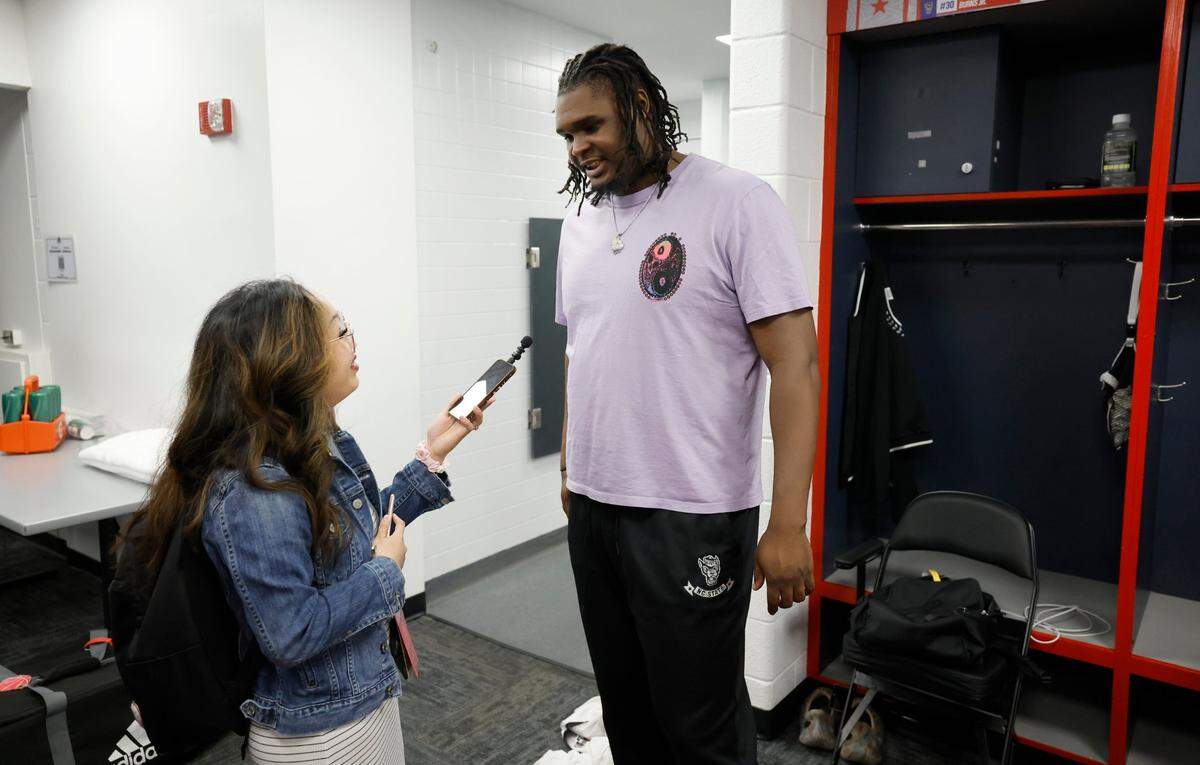 Jadyn Watson-Fisher talks to N.C. State’s DJ Burns Jr. in the locker room after the Wolfpack’s 94-85 victory over Louisville in the first round of the 2024 ACC Men’s Basketball Tournament at Capital One Arena in Washington, D.C., Tuesday, March 12, 2024.