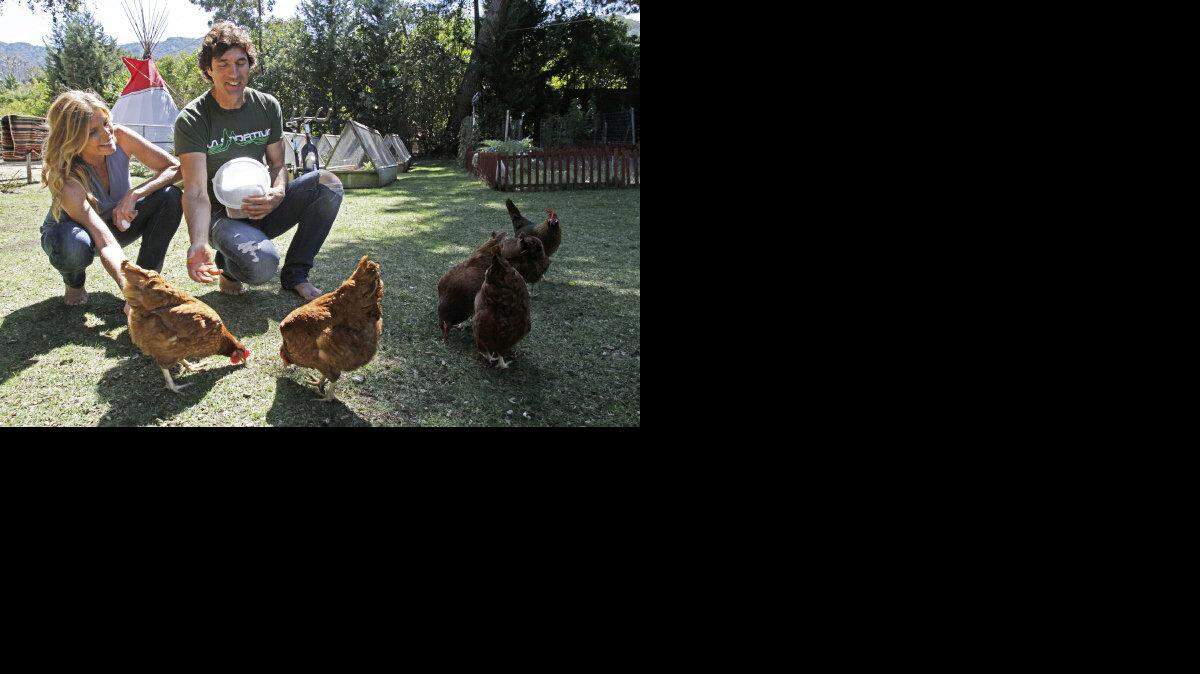 Mariel Hemingway and her significant other, Bobby Williams, feed their chickens at their home in Calabasas, California, on March 12, 2013. The two have written a book titled "The Willing Way," about healthy living. They use some of the eggs and take the remaining to share at the farmers market.
