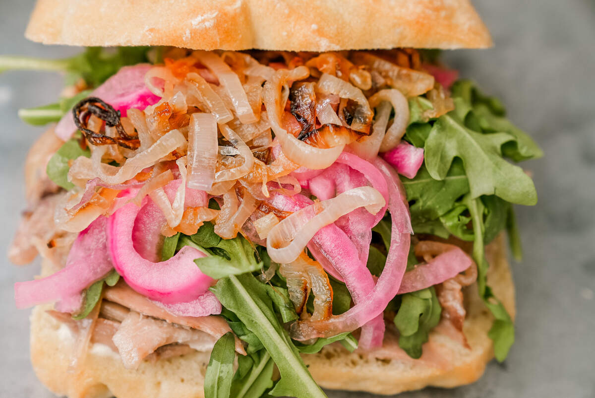 This duck confit sandwich will be one of many gourmet options in a rotating menu at Ladyfinger’s new restaurant and grocery store.