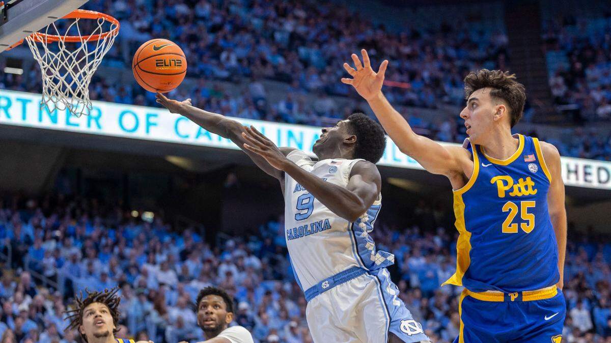 North Carolina forward Drake Powell (9) drives to the basket against Pitt forward Guillermo Diaz Graham (25) in the second half on Saturday, February 8, 2025 at the Smith Center in Chapel Hill, N.C. Powell scored 10 points in the Tar Heels’ 67-66 victory.
