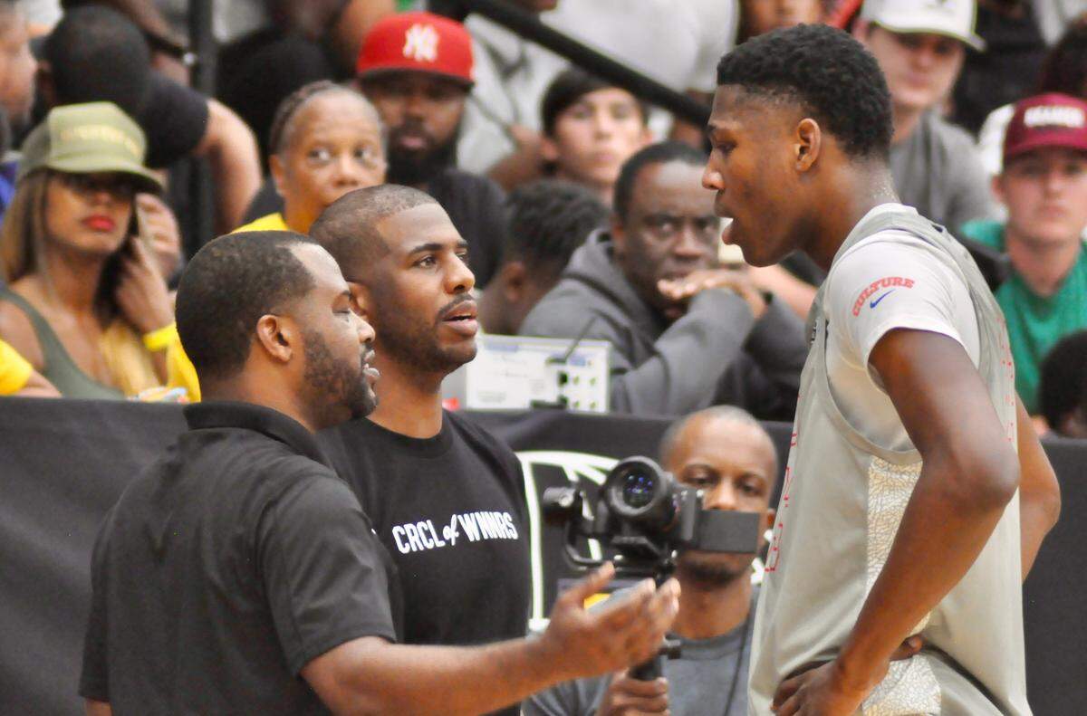 Phoenix Suns guard Chris Paul, a native of Winston-Salem, instructs Team CP3 forward G.G. Jackson during a stop in the action against The Scholars in the Nike Elite Youth Basketball League (EYBL) Peach Jam tournament on July 22, 2022 in North Augusta, S.C.