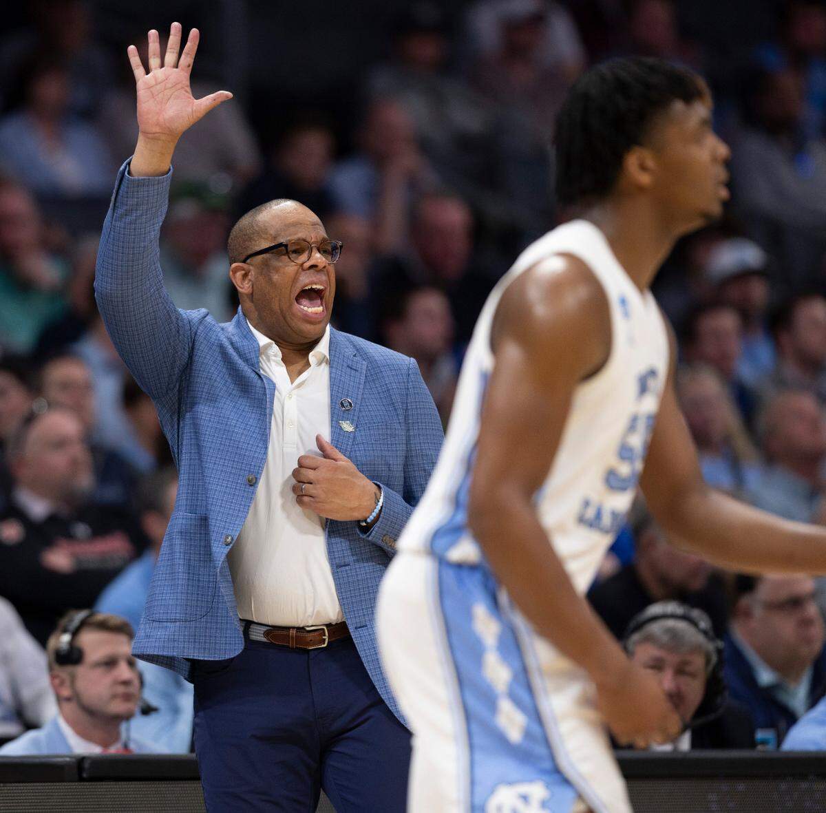 North Carolina coach Hubert Davis calls the play for the offense in the second half against Wagner on Thursday, March 21, 2024 during the NCAA Tournament at Spectrum Center in Charlotte, N.C.