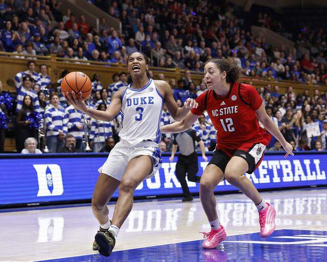 Duke’s Ashlon Jackson drives to the basket past N.C. State’s Khamil Pierre during the second half of the Blue Devils’ 83-65 win on Thursday, Feb. 19, 2026, at Cameron Indoor Stadium in Durham, N.C.