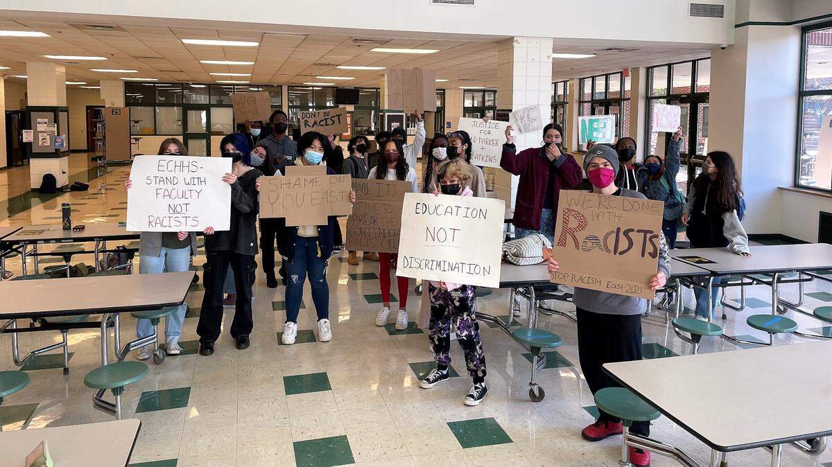 East Chapel Hill High School students protest after learning that two exceptional children’s teaching assistants reported being asked to move from their classrooms after a parent raised concerns that a student could have Black male teachers.