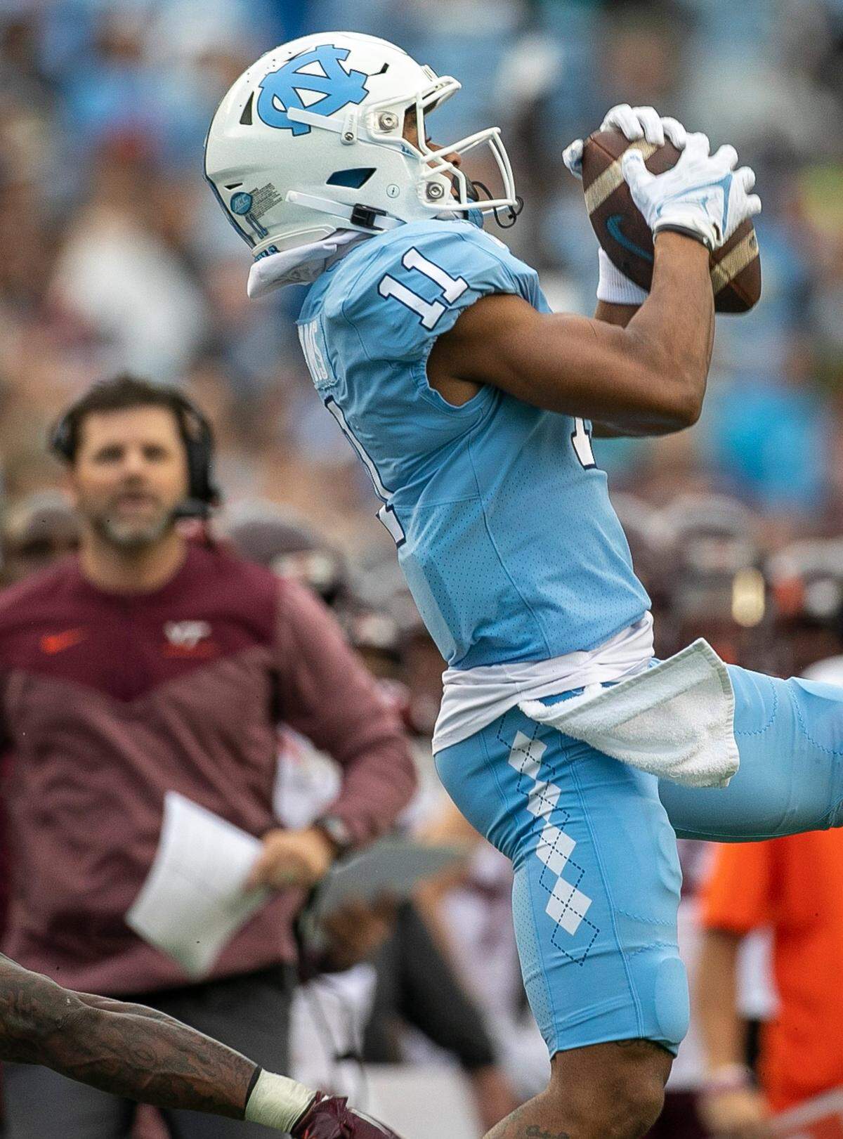 North Carolina wide receiver Josh Downs (11) pulls in a 24-yard pass completion from quarterback Drake Maye in the second quarter against Virginia Tech on Saturday, October 1, 2022 at Kenan Stadium in Chapel Hill, N.C.