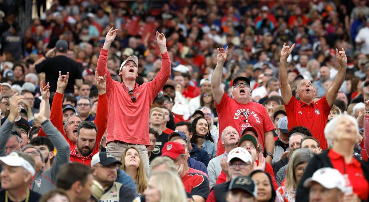 Fans cheer on the Wolfpack during N.C. State’s practice at State Farm Stadium in Glendale, Ariz., Friday, April 5, 2024. The Wolfpack will face Purdue in the NCAA Tournament national semifinals Saturday.