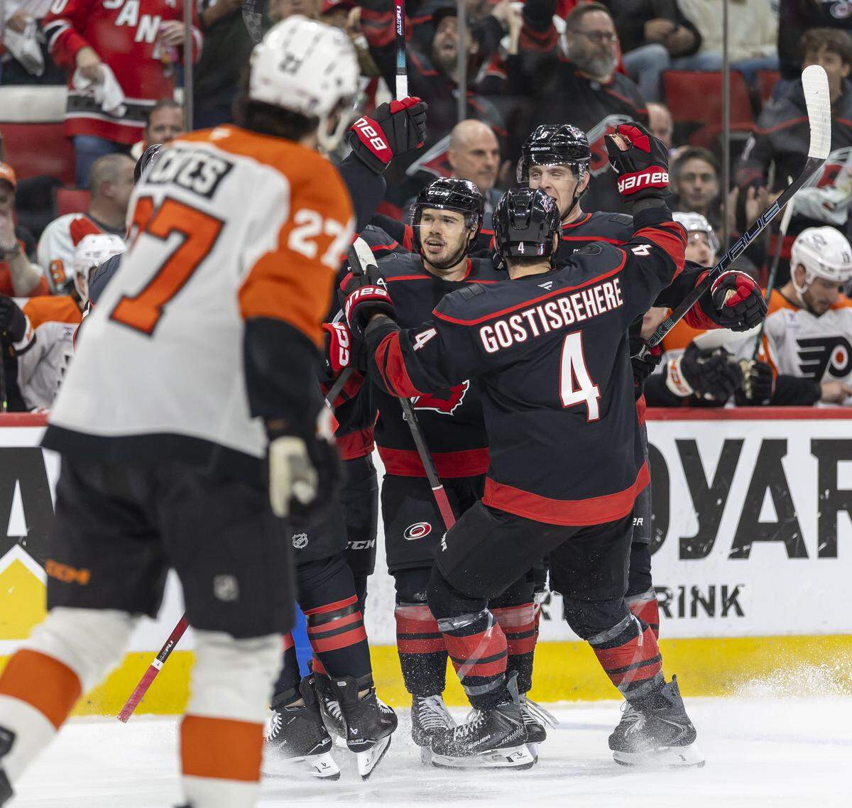 Carolina Hurricanes center Logan Stankoven, center, is surrounded by teammates after scoring to take a 1-0 lead over Philadelphia in the first period of Game 1 on Saturday, May 2, 2026, during the second round of the Stanley Cup Playoffs at Lenovo Center in Raleigh.