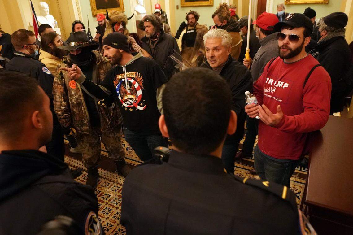 People protesting the presidential election results inside the Capitol in Washington on Wednesday, Jan. 6, 2020. The Capitol building was placed on lockdown, with senators and members of the House locked inside their chambers, as Congress began debating President-elect Joe Biden’s victory. President Trump addressed supporters near the White House before protesters marched to Capitol Hill. (Erin Schaff/The New York Times)