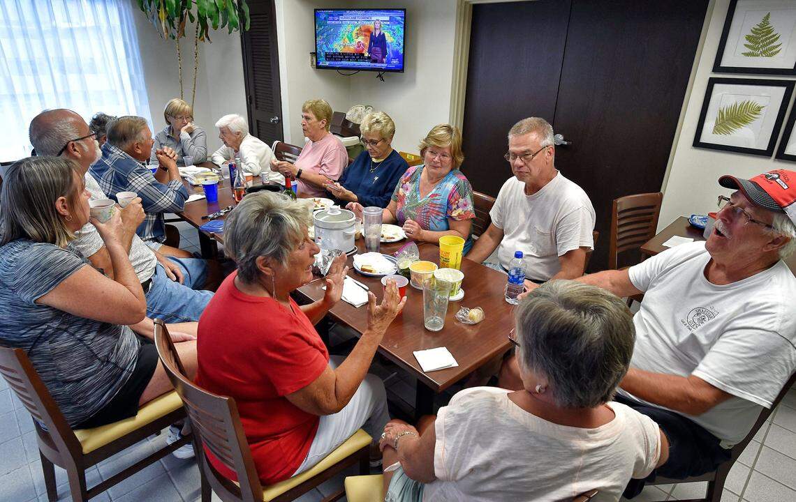 More than a dozen residents of the Country Lakes development in Little River, S.C., ended up at the same Sleep Inn hotel in town, which is designed to withstand high winds and welcomes dogs, making it a popular refuge from a hurricane. They began arriving Wednesday and gather at 4:30 p.m. daily through the storm for a communal meal.
