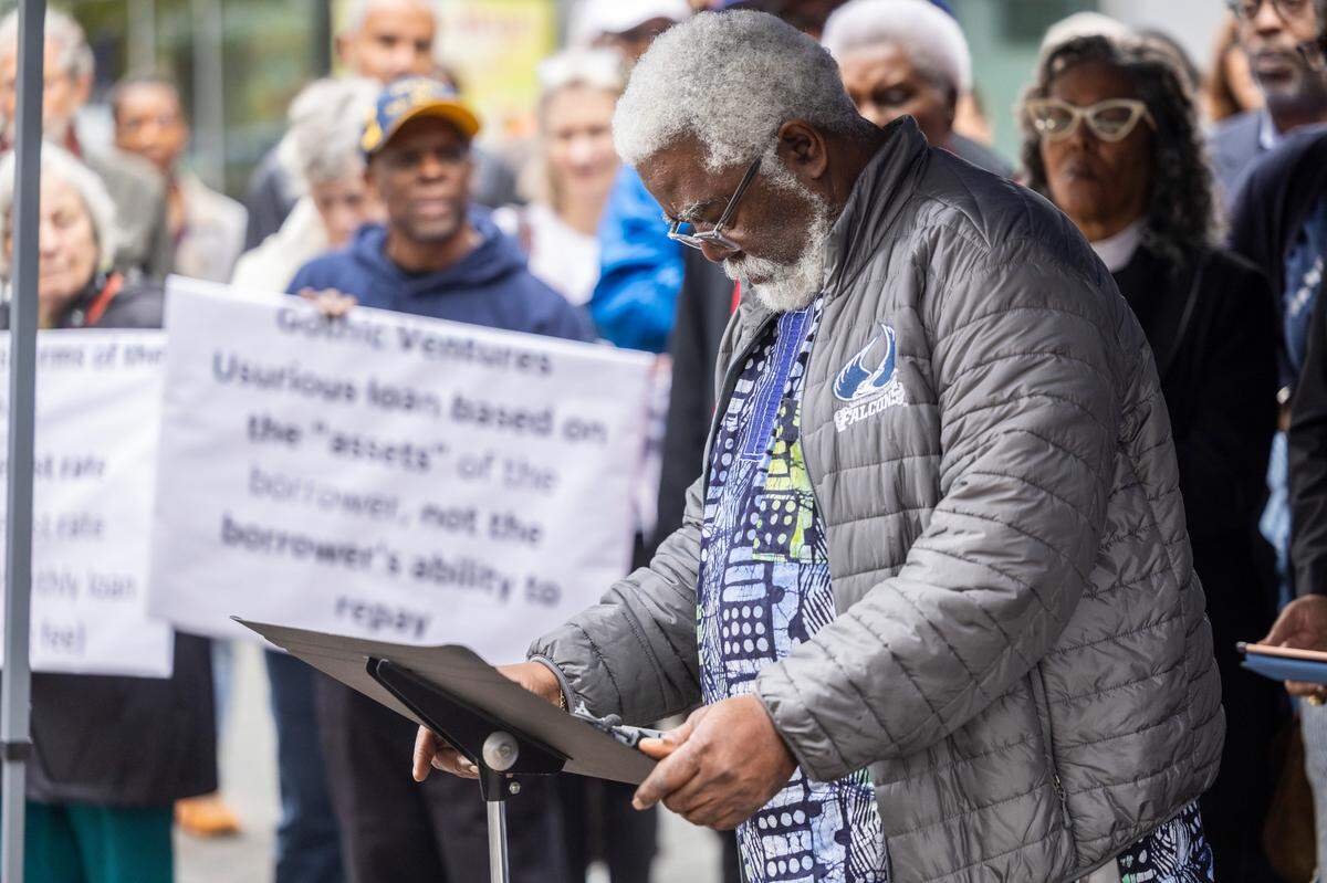 Harold Mallette, a 1981 St. Augustine’s University graduate, speaks out for more favorable terms on a multi-million dollar loan for the struggling historically Black university during a rally at City Plaza in Raleigh on Wednesday, Nov. 20, 2024. The event was organized by dozens of clergy members, civil rights activists, and university alumni.