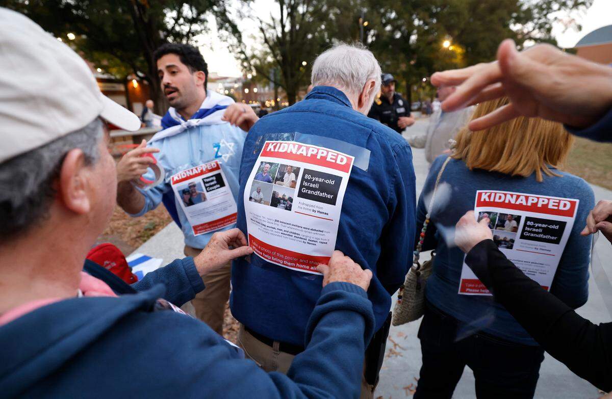 Before a rally and march for Israel in Moore Square in Raleigh on Nov. 7, 2023, attendees had posters taped to themselves of some of the people kidnapped when Hamas attacked Israel in October.